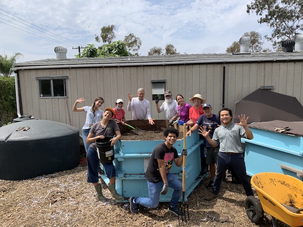 A group of people attending a community composting event