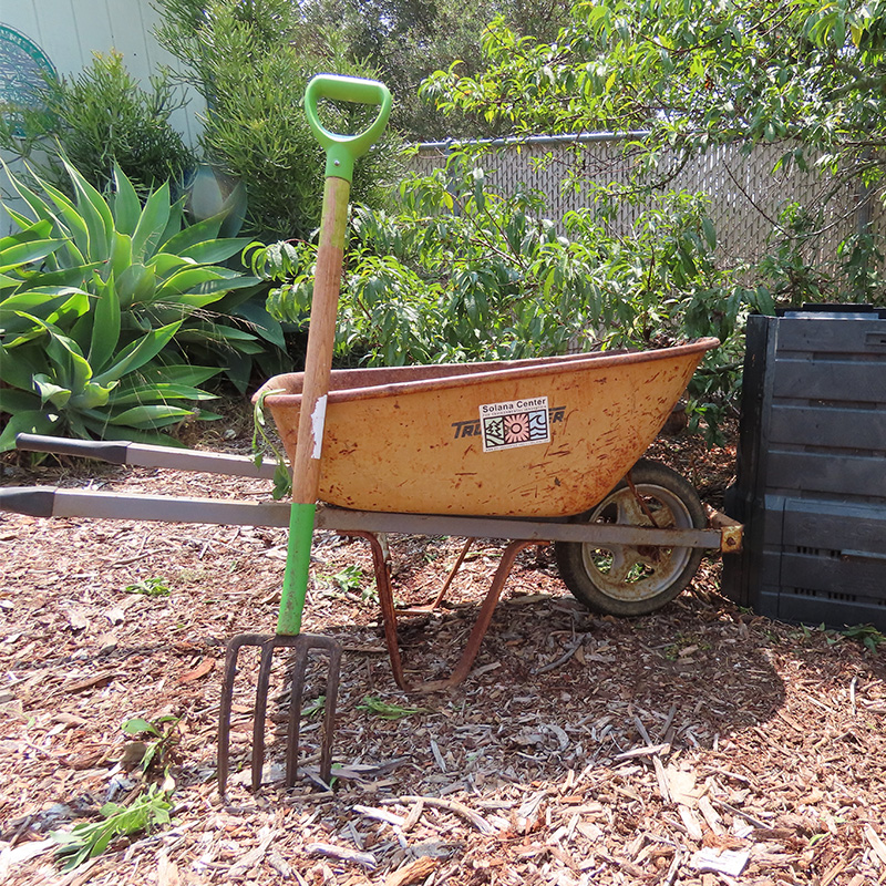 Compost bin and wheel barrow garden tools