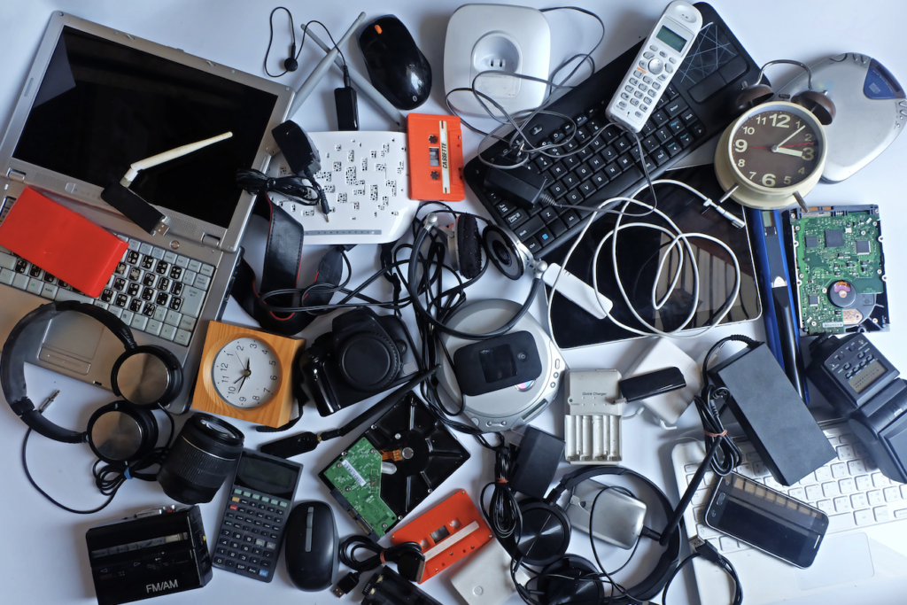 collection of used electronic devices on a desk